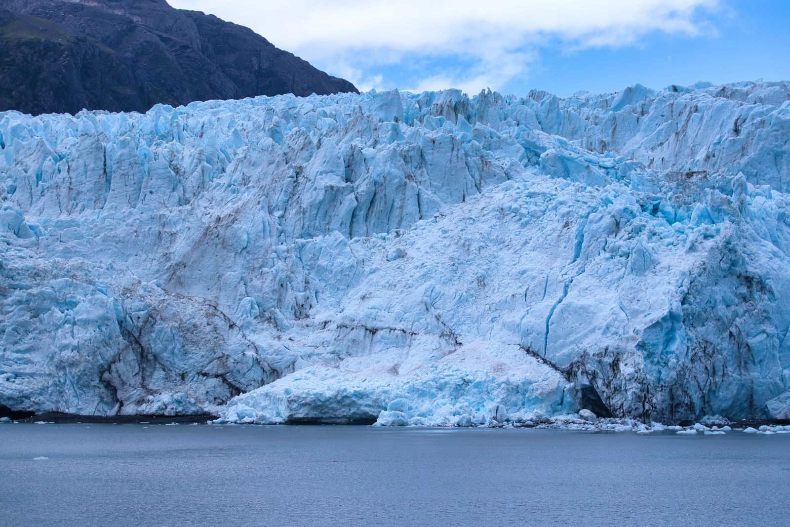 Blue tidewater glacier meeting the sea, the highlight of the best Alaska cruise itinerary