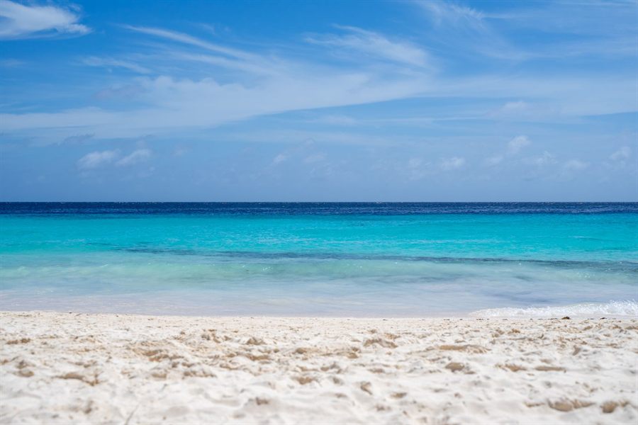 White sand and clear turquoise water on a Caribbean beach